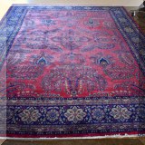 D05. Handknotted red and blue Persian rug. Approx. 9' x 12' 